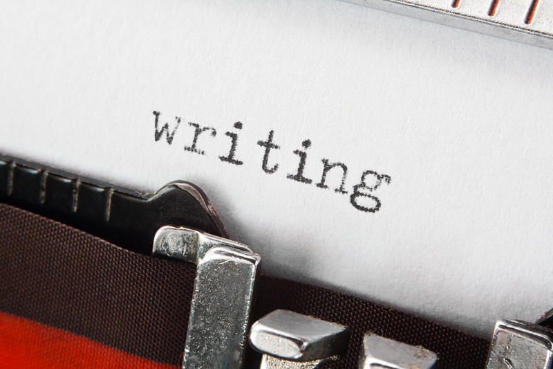 a typewriter typing the word "writer"