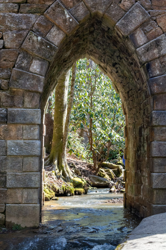 View of the tunnel beneath an old stone bridge