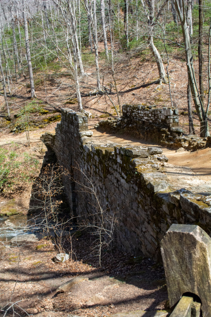 View of a road crossing an old stone bridge